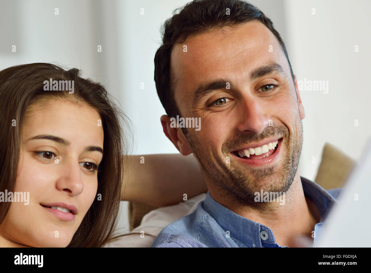 relaxed young couple working on laptop computer at home Stock Photo - Alamy