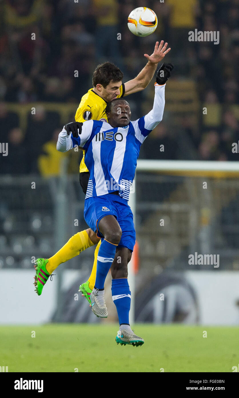 Dortmund, Germany. 18th Feb, 2016. Dortmund's Sokratis (back) vies for the ball with Porto's Vincent Aboubakar (front)during the UEFA Europa League between Borussia Dortmund and FC Porto at Signal Iduna Park in Dortmund, Germany, 18 February 2016. Photo: Guido Kirchner/dpa/Alamy Live News Stock Photo