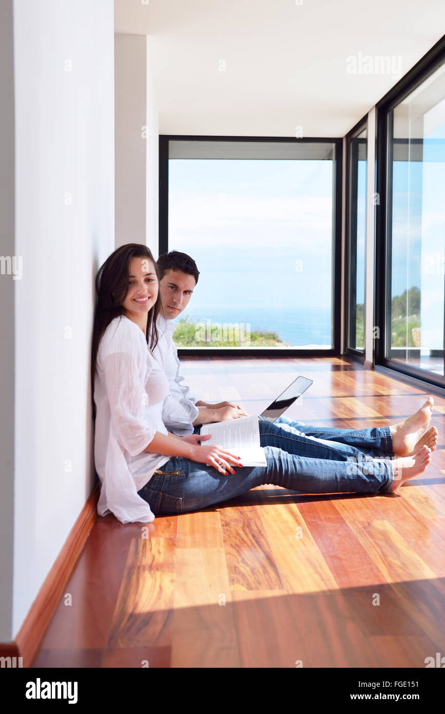 relaxed young couple working on laptop computer at home Stock Photo - Alamy