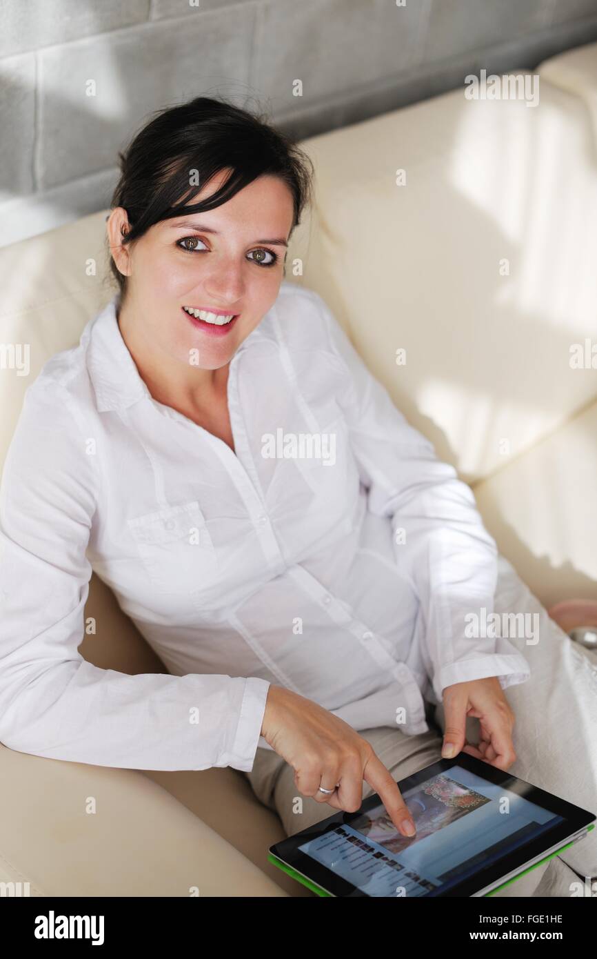 woman using tablet pc at home Stock Photo - Alamy