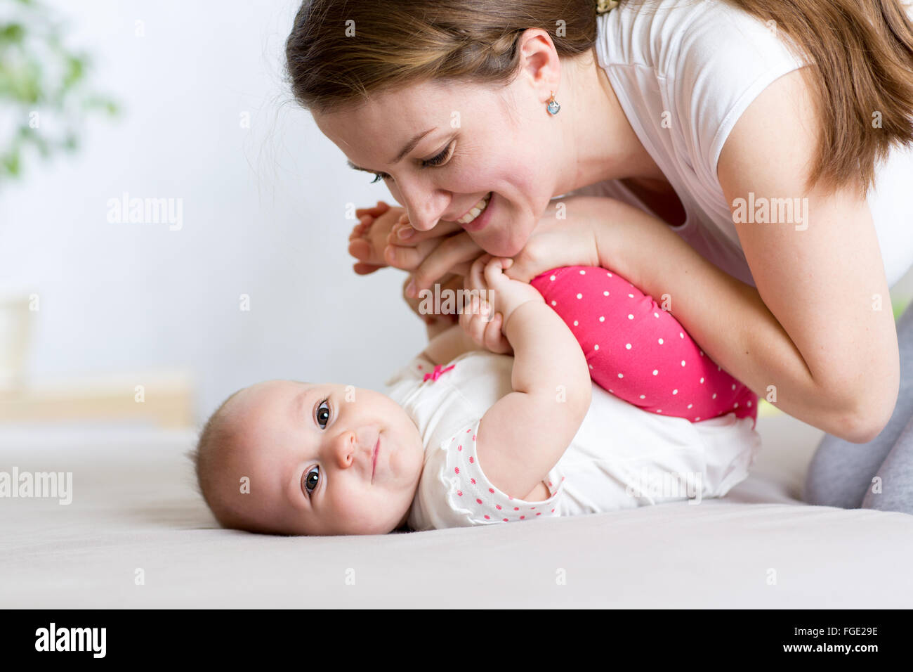 Mother and Baby having fun pastime together Stock Photo