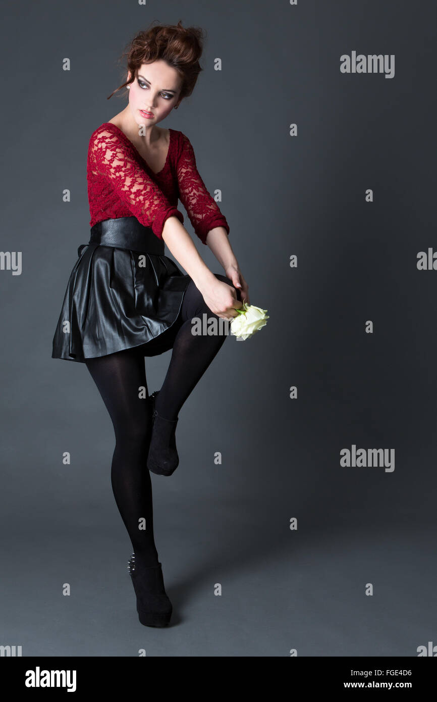 Young woman in leather outfit, Fashion Stock Photo