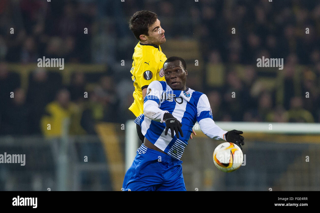 Dortmund, Germany. 18th Feb, 2016. Dortmund's Sokratis (back) vies for the ball with Porto's Vincent Aboubakar (front) in action during the UEFA Europa League between Borussia Dortmund and FC Porto at Signal Iduna Park in Dortmund, Germany, 18 February 2016. Photo: Guido Kirchner/dpa/Alamy Live News Stock Photo