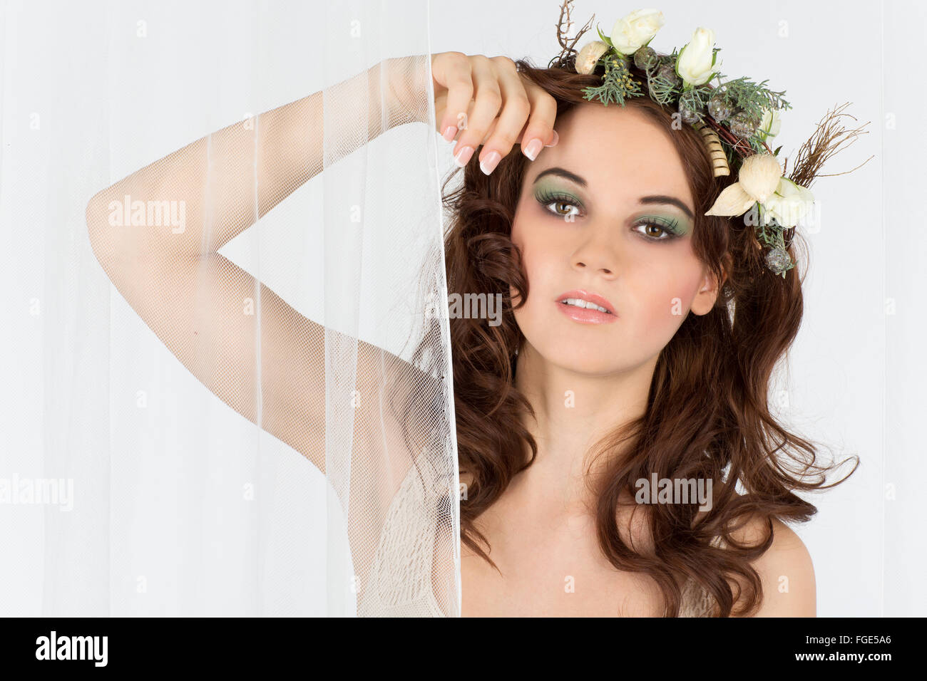 Young woman with flower arrangement as a headdress Stock Photo