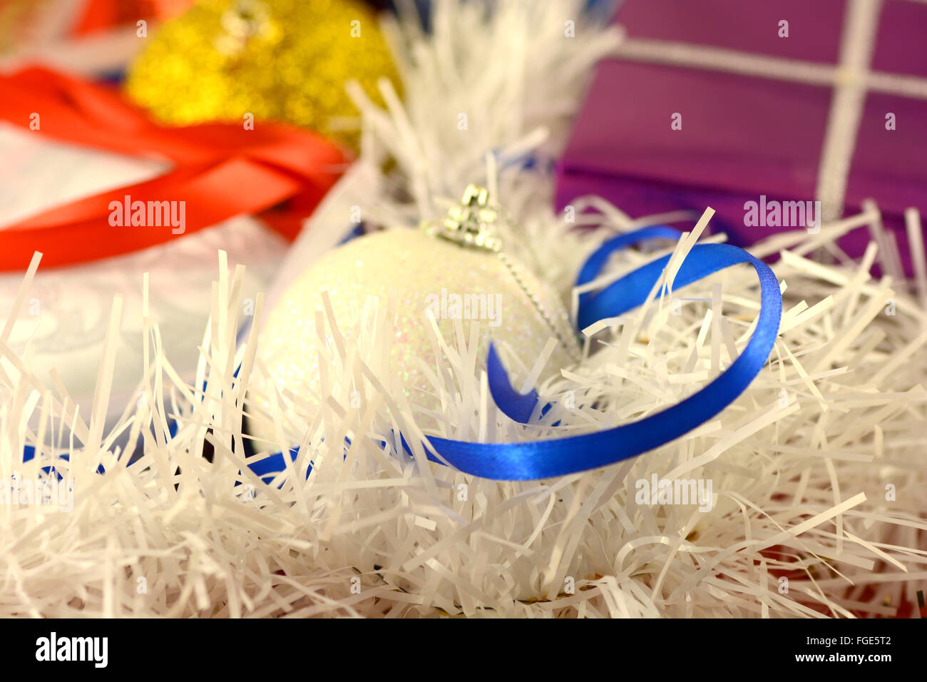Christmas background with red and blue ribbon and white balls Stock