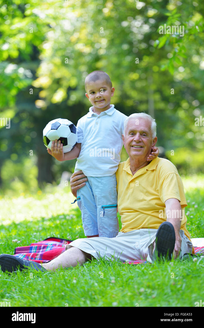 happy grandfather and child in park Stock Photo