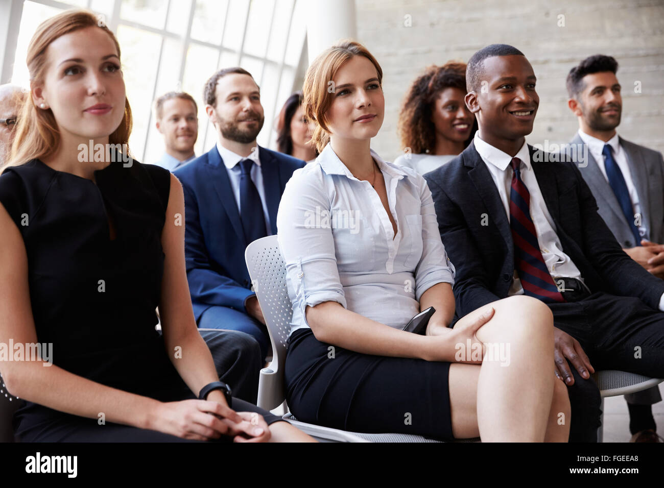 Audience Listening To Speaker At Business Conference Stock Photo