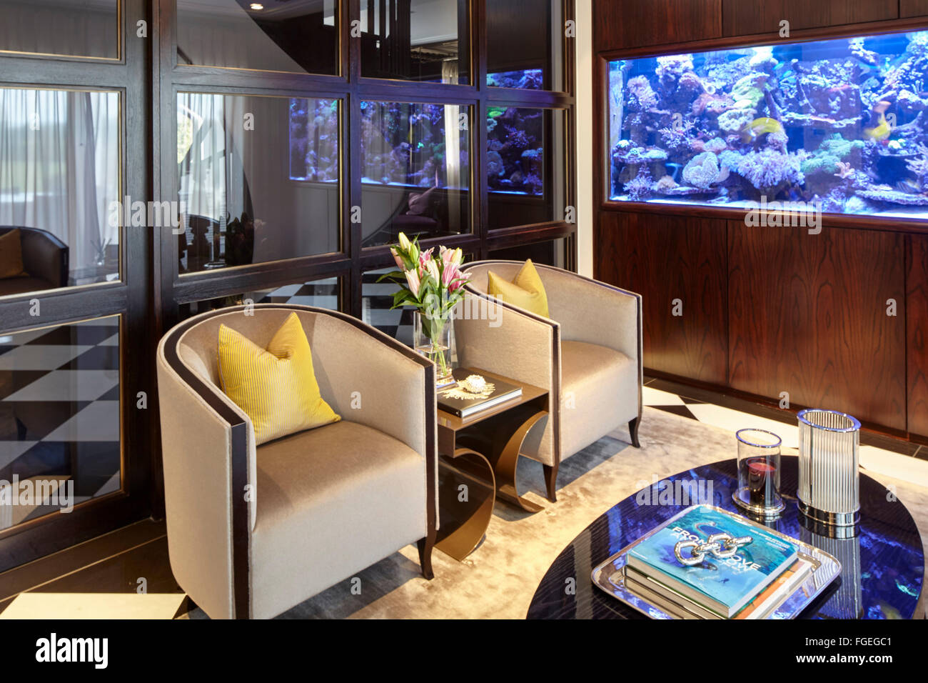 Sitting Room With Fish Tank And Captain Chairs Tudor Hall