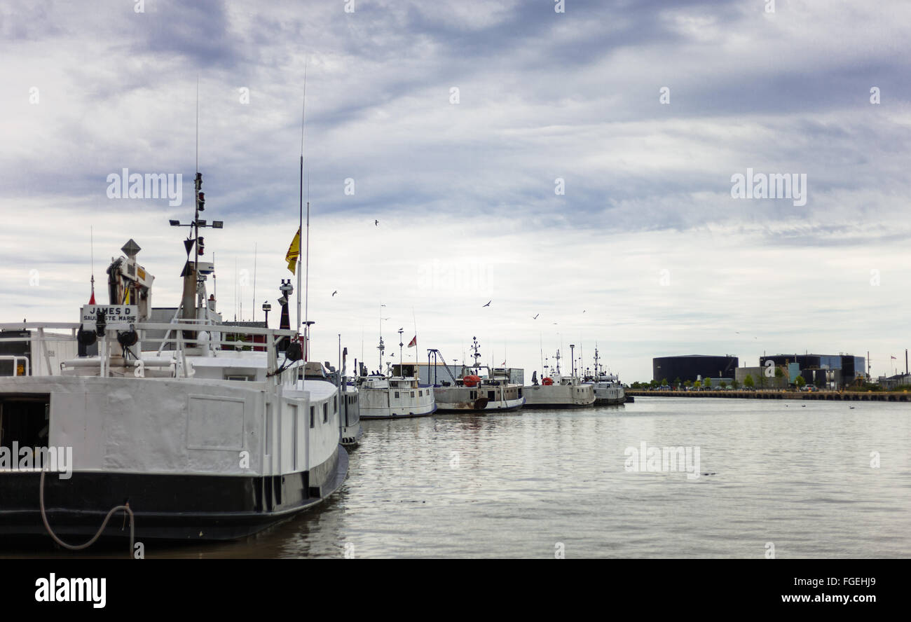 August 8, 2015 - Port Stanley, Canada. Commercial fishing trawlers tied up along the dock in the fishing village of Port Stanley Stock Photo