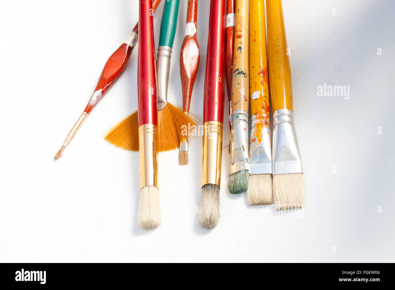 Artists brushes and paint container Stock Photo Alamy