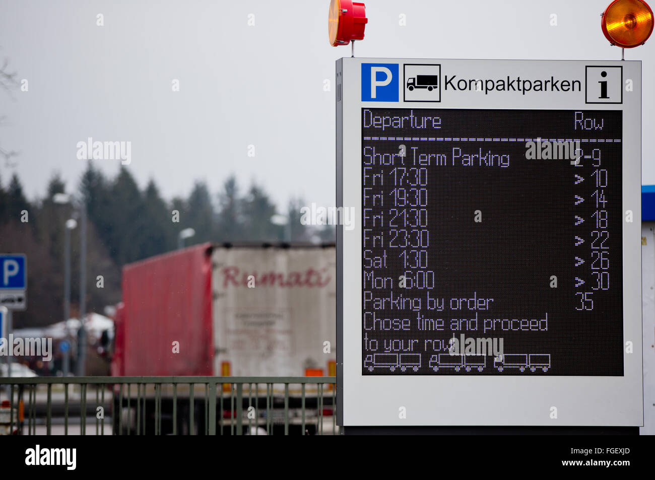 Velburg, Germany. 19th Feb, 2016. A board informing on the number of free truck parking lots at the service area Jura West on Autubahn 3 near Velburg, Germany, 19 February 2016. The pilot site uses a steering system that allows trucks to park directly behind and next to each other, without a central passage. The number of parking lots can thus be increased recognisably. PHOTO: DANIEL KARMANN/dpa/Alamy Live News Stock Photo