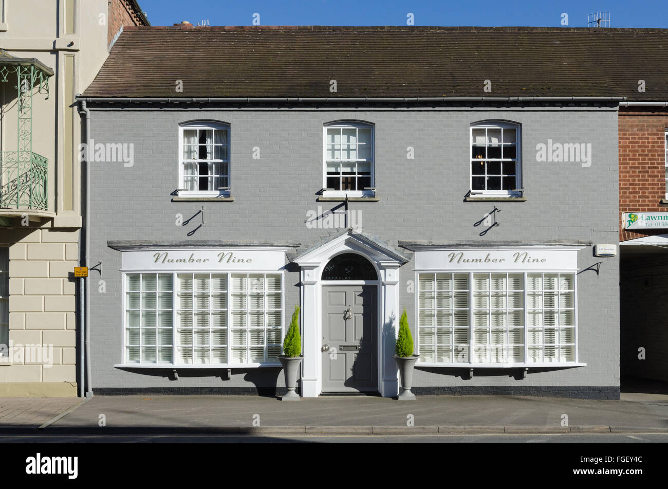Grey painted house called number nine in pershore worcestershire stock image