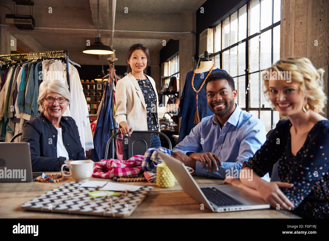 Portrait Of Four Fashion Designers In Meeting Stock Photo Alamy