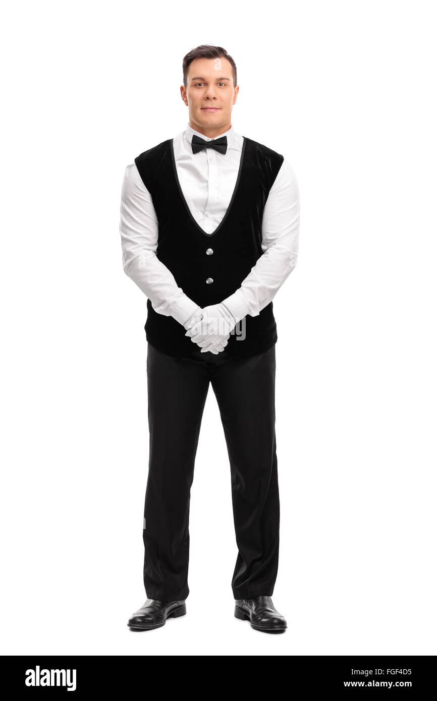 Full length portrait of a young male waiter looking at the camera isolated on white background Stock Photo