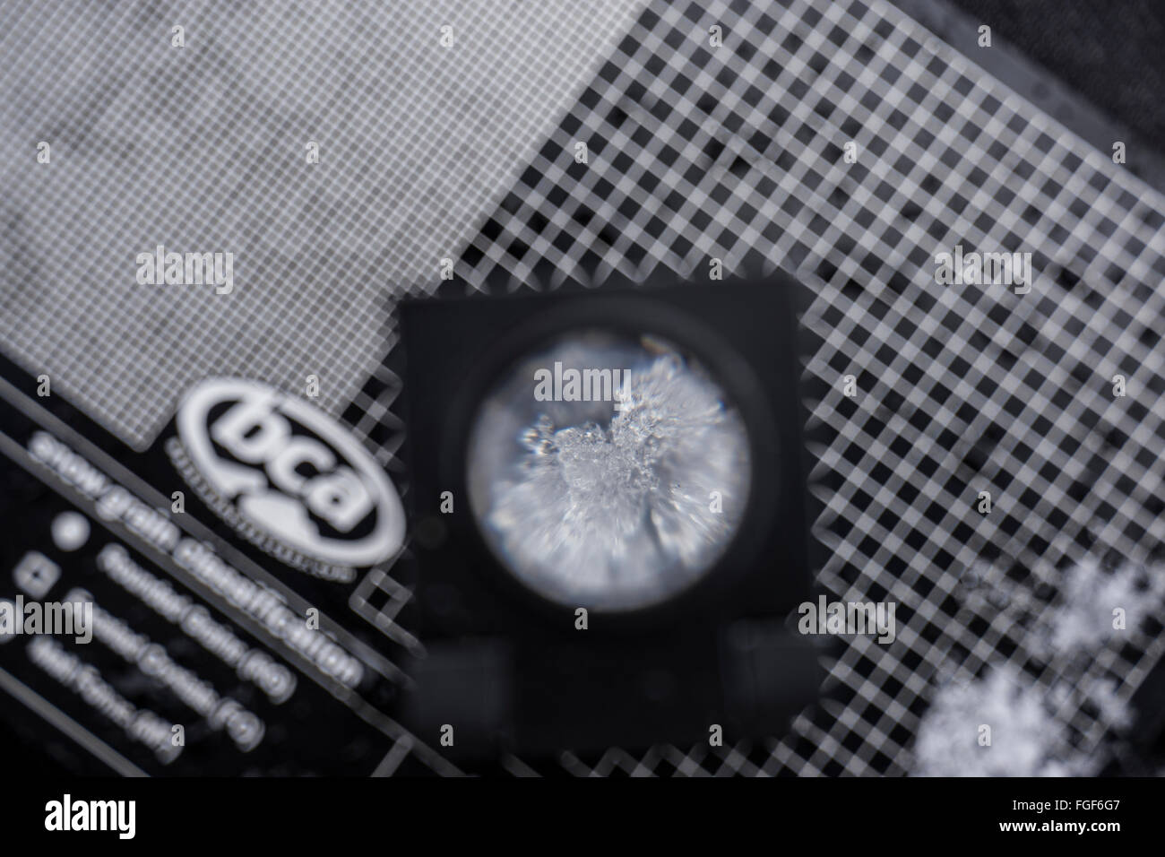 Looking at snow crystals with loupe to analyze snow pack and measure the safety Stock Photo