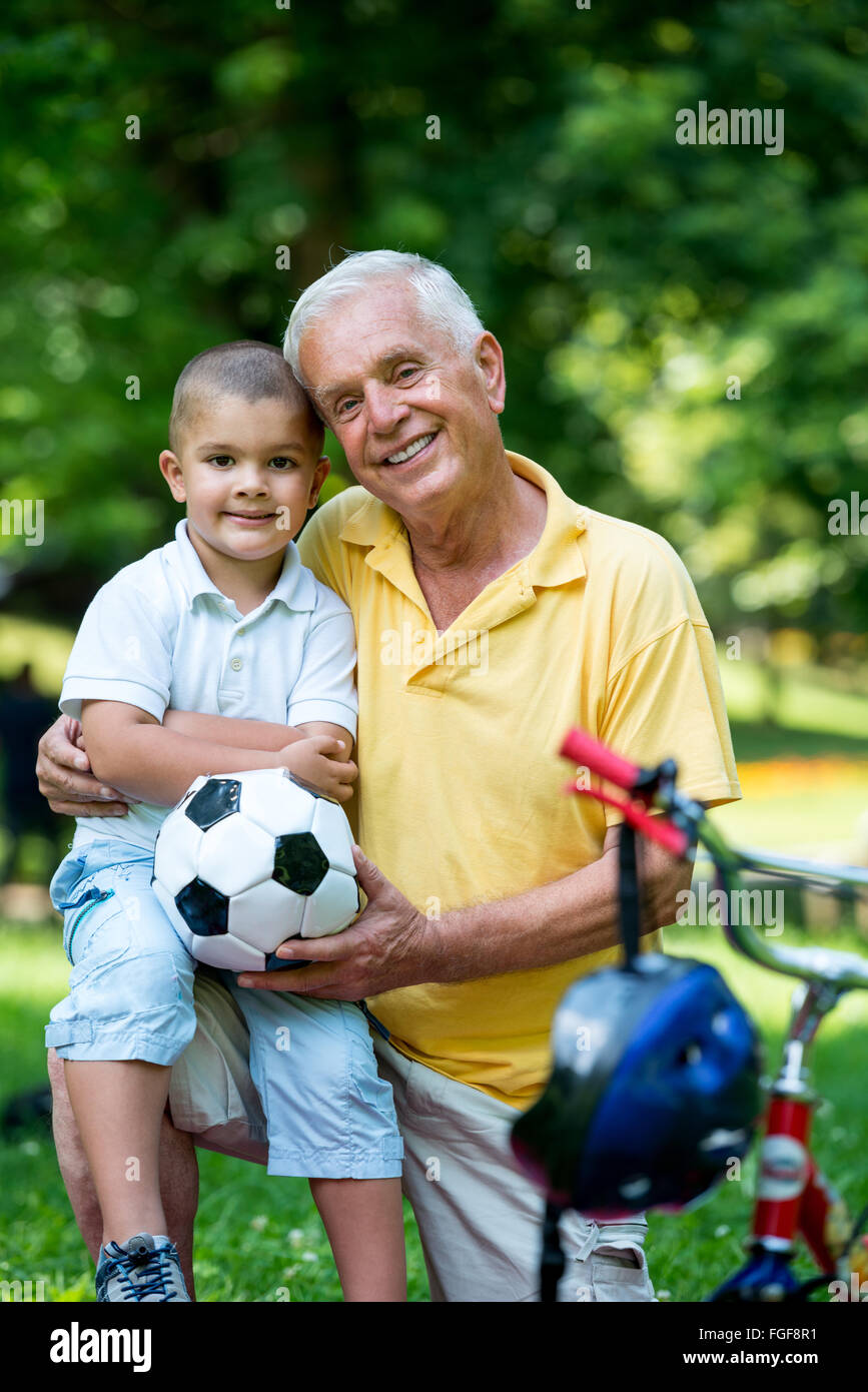 grandfather and child have fun in park Stock Photo Alamy