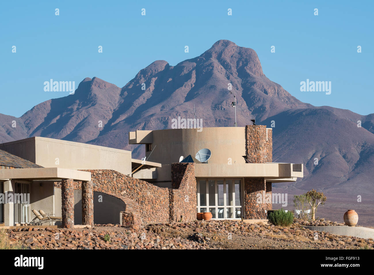 Luxury lodge with a mountain towering in the background Stock Photo