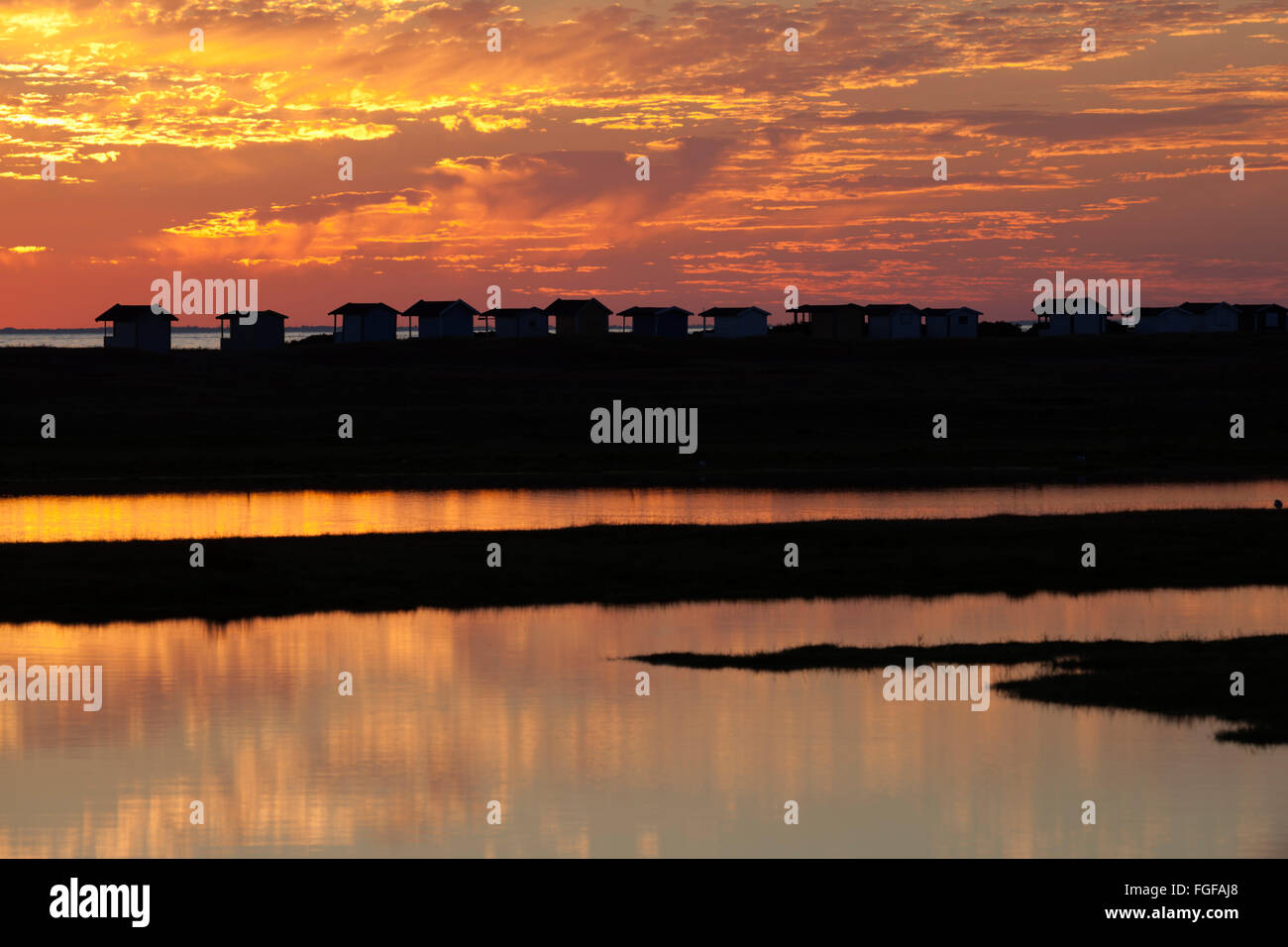 Beach huts and lagoon at sunset, Skanör Falsterbo, Falsterbo Peninsula, Skåne,  South Sweden, Sweden, Scandinavia, Europe Stock Photo