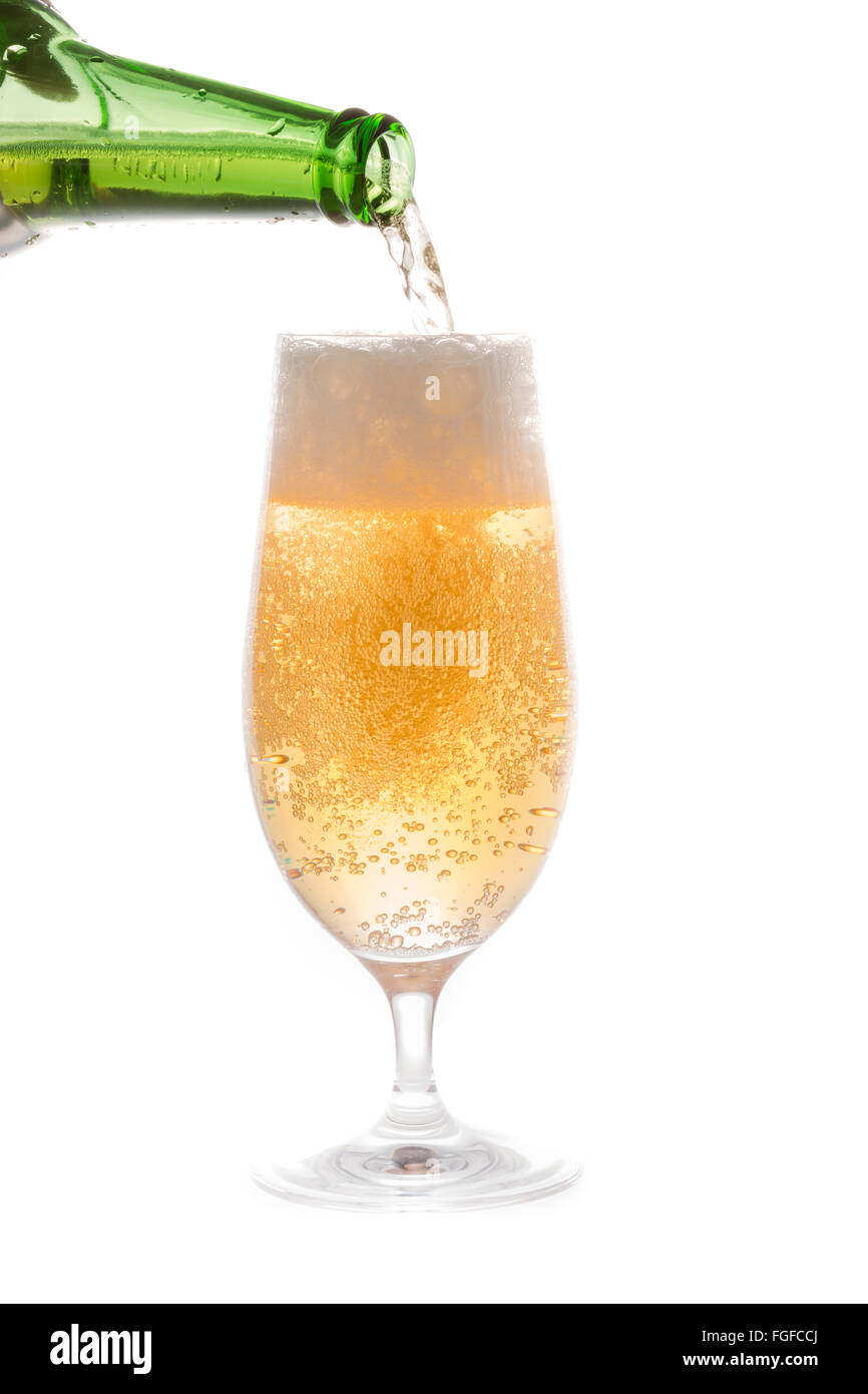 Beer Pouring from Bottle into Glass Stock Photo Alamy
