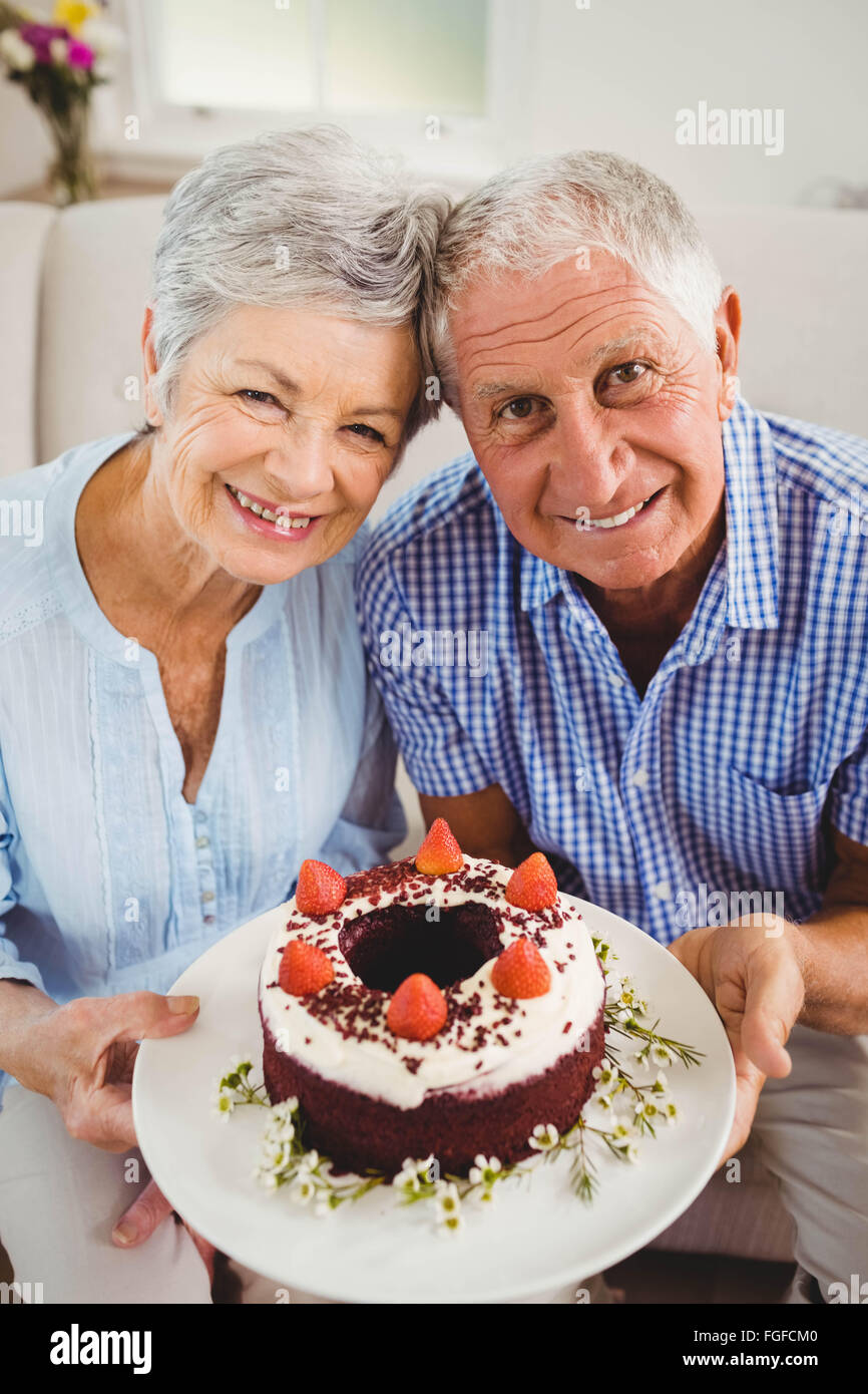 Old woman holding birthday cake hi-res stock photography and images - Alamy