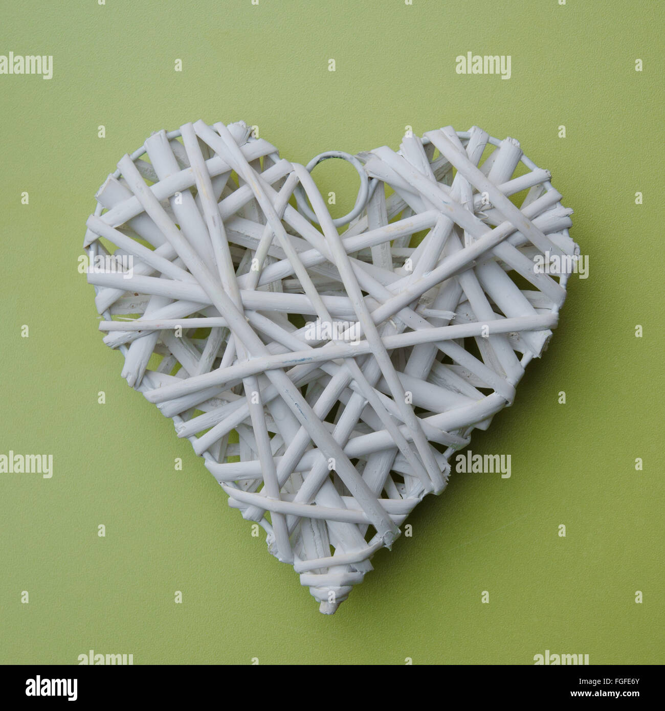 white heart shape over green background Stock Photo - Alamy