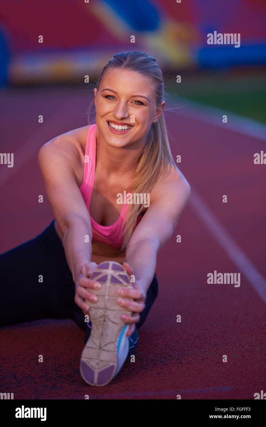 sporty woman on athletic race track Stock Photo Alamy