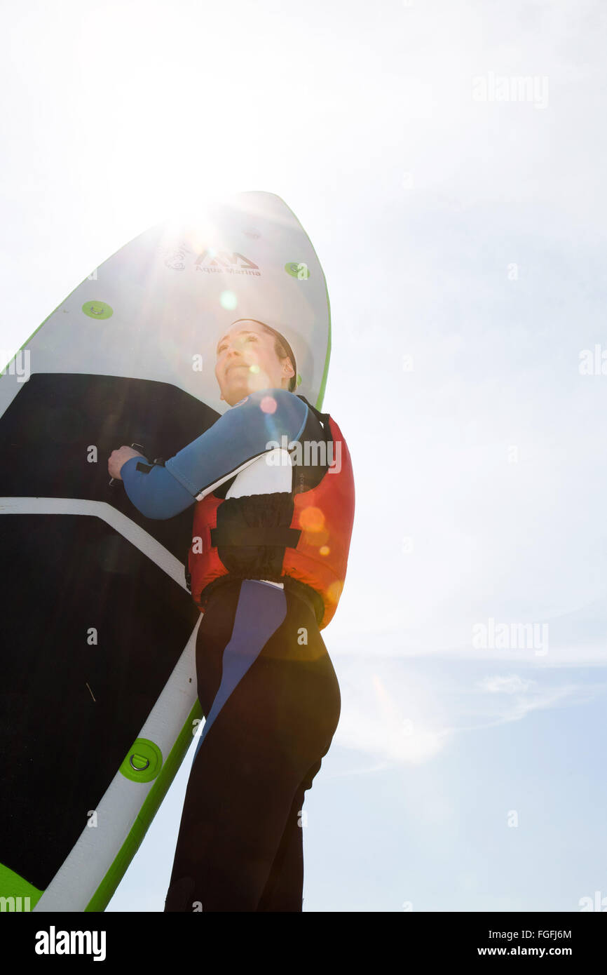 Paddle board woman Stock Photo - Alamy