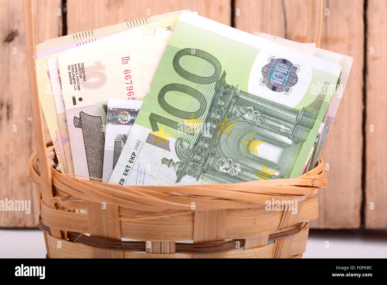 money set in a basket, dollars, euro and russian money Stock Photo