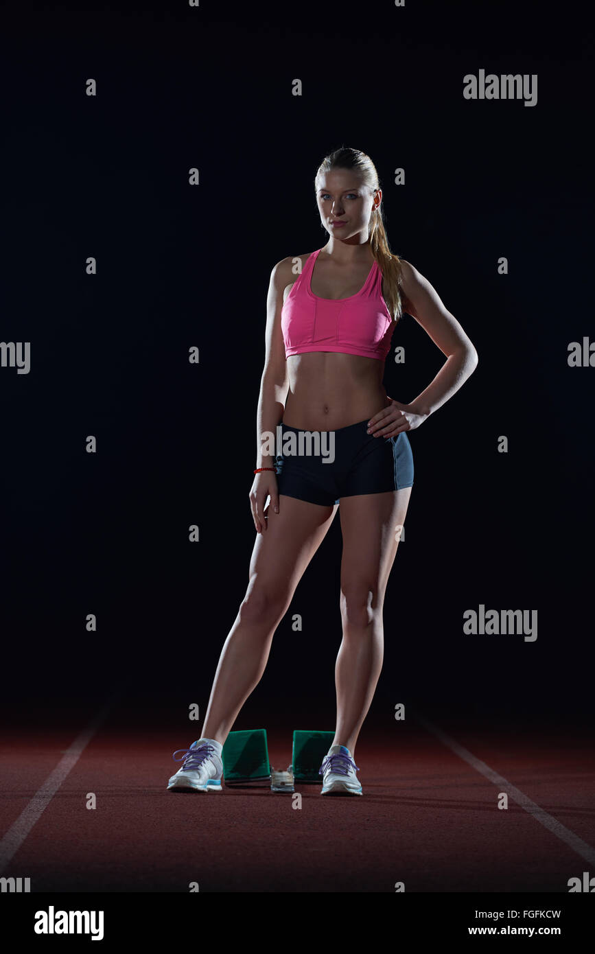 Female sprinter leaving starting blocks hi-res stock photography and ...