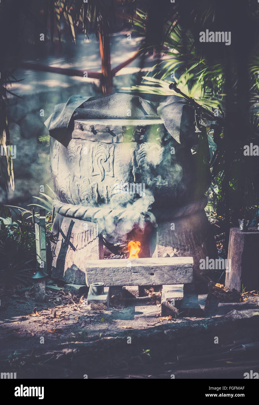 Ancient mayan cauldron in dense mexican jungle Stock Photo