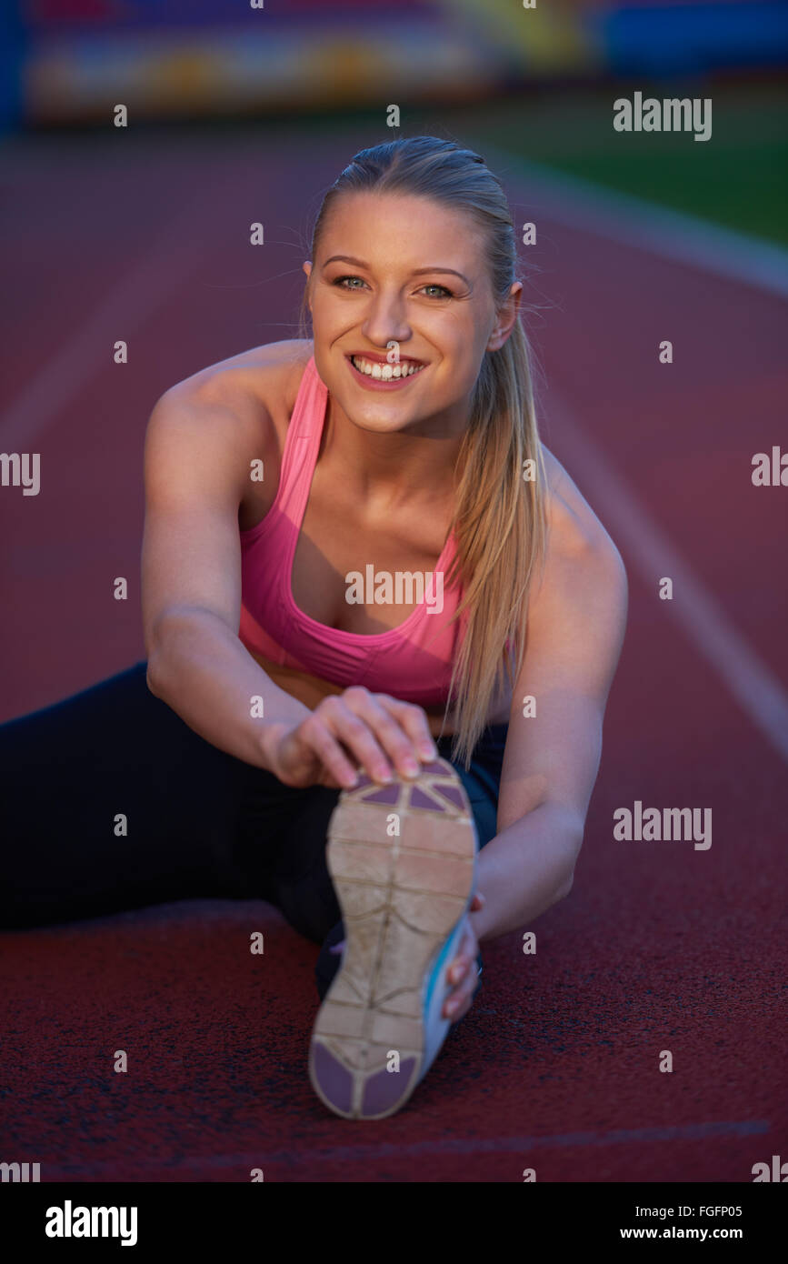 sporty woman on athletic race track Stock Photo Alamy