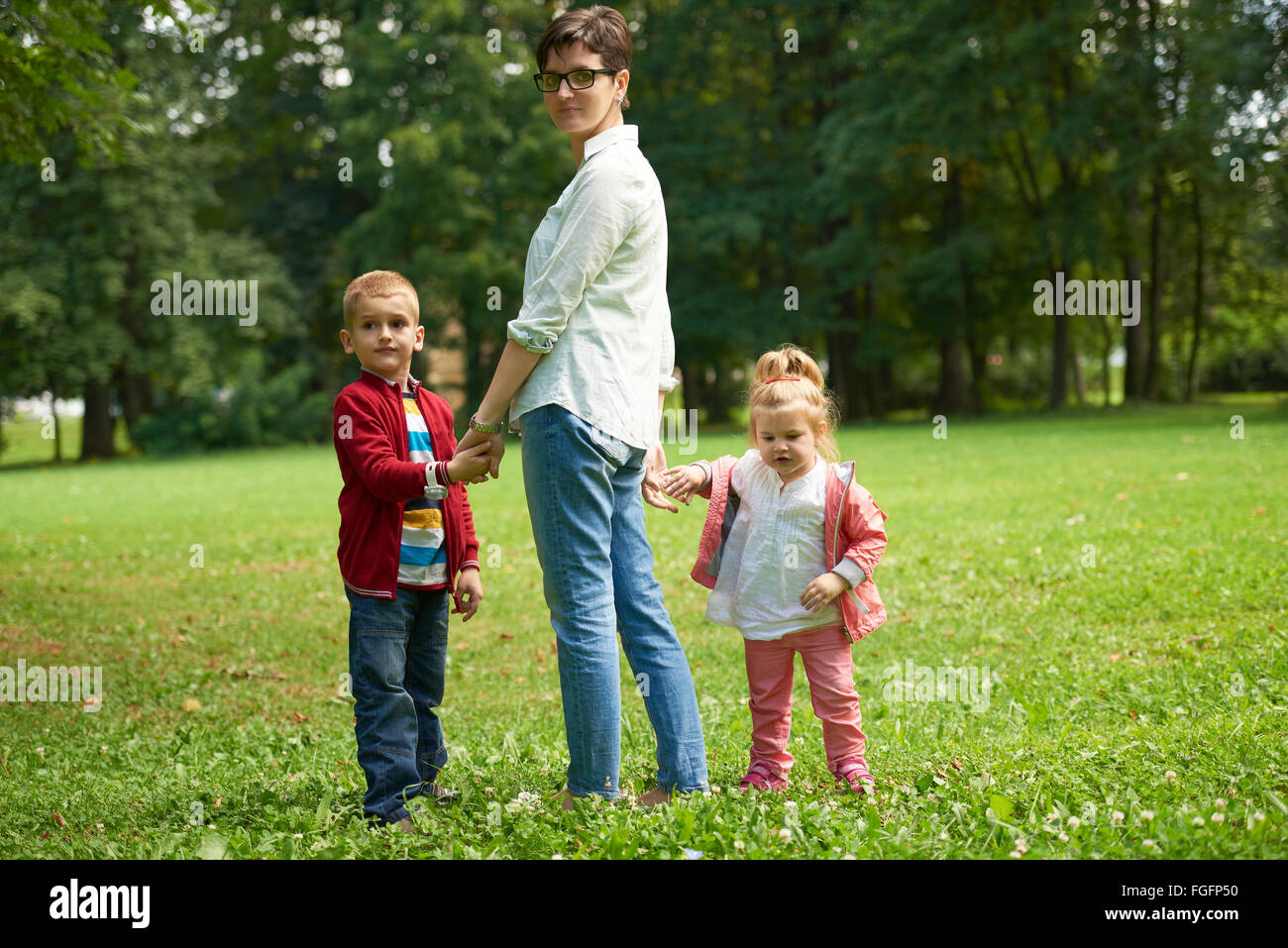 happy family playing together outdoor in park Stock Photo - Alamy
