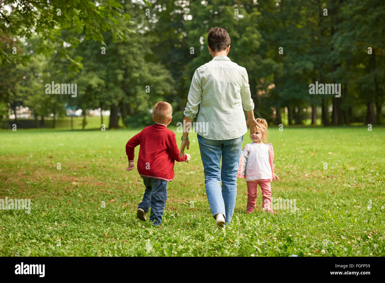 happy family playing together outdoor in park Stock Photo - Alamy