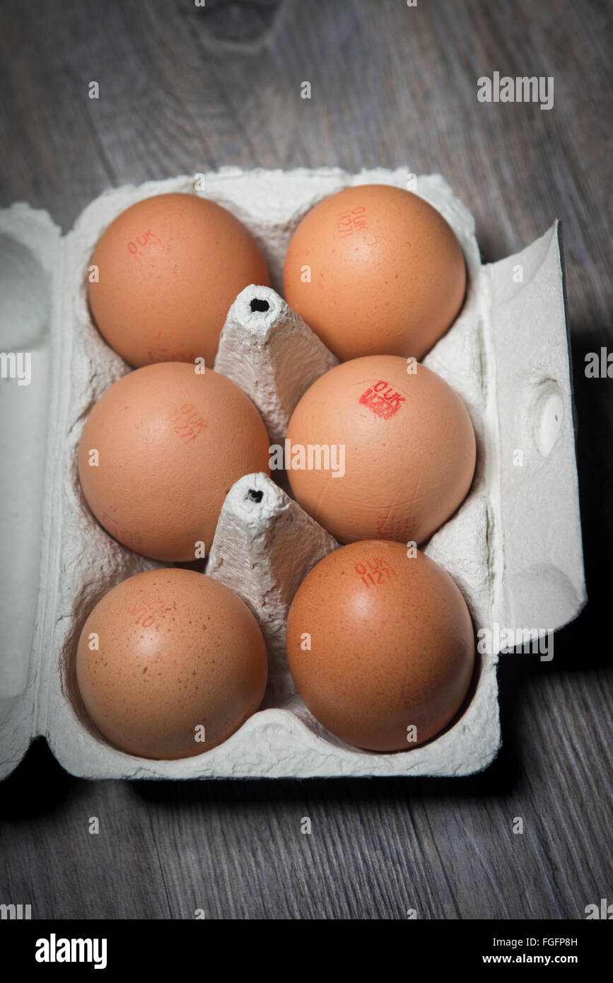 six organic free range eggs in an egg box Stock Photo