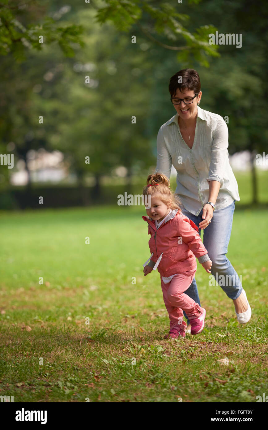 happy family playing together outdoor in park Stock Photo - Alamy