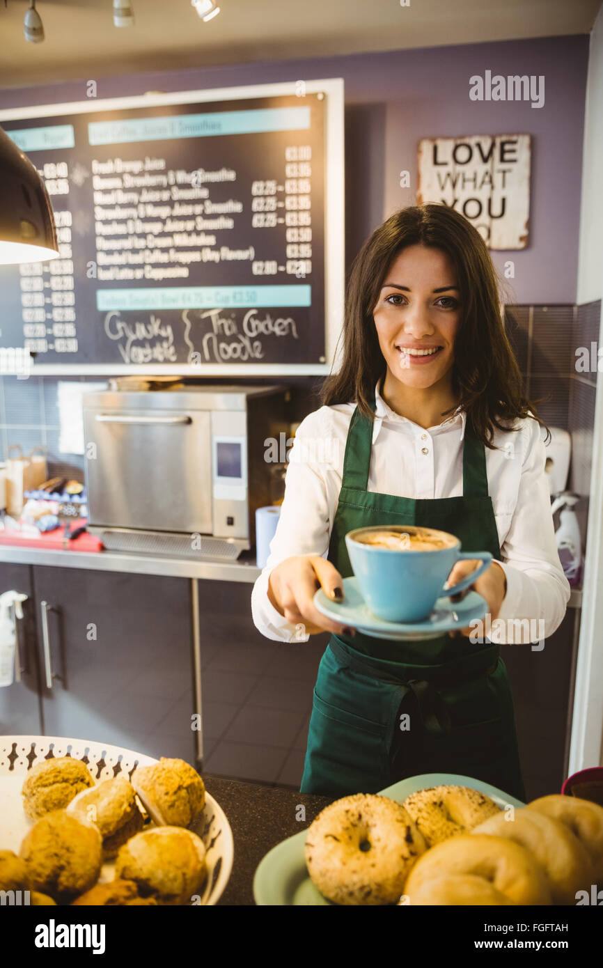 Waitress serving a cup of coffee Stock Photo Alamy