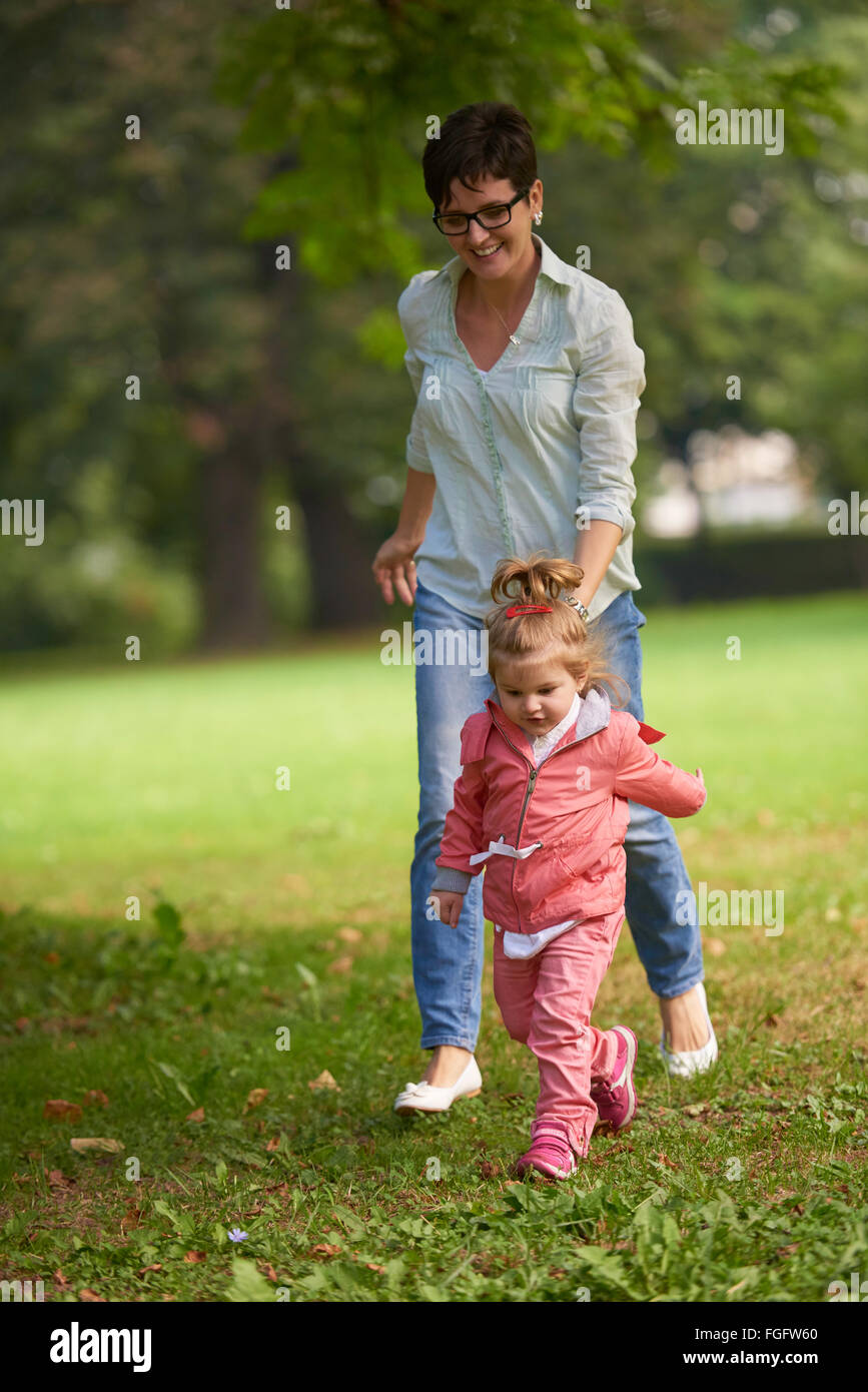 happy family playing together outdoor in park Stock Photo - Alamy