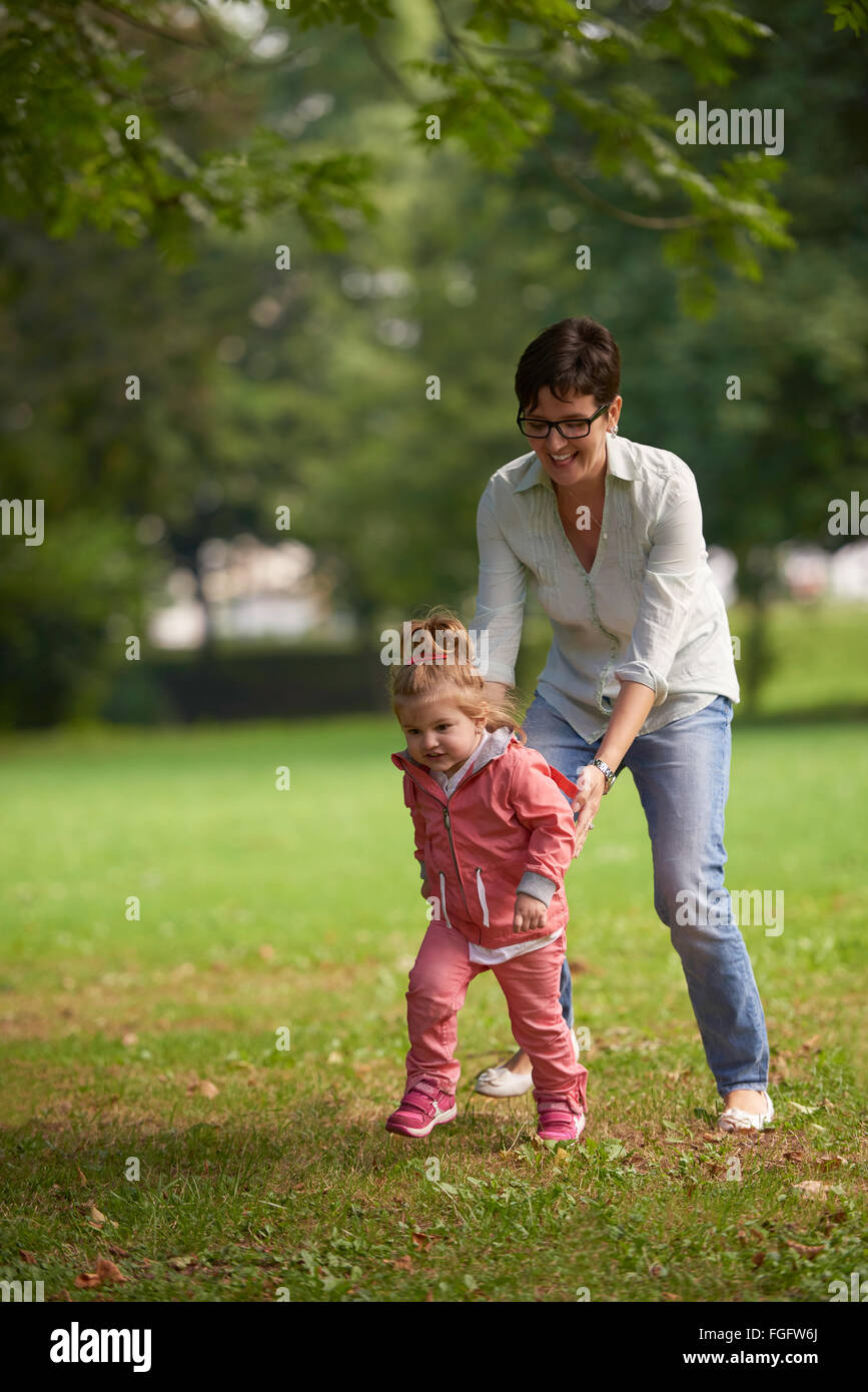 happy family playing together outdoor in park Stock Photo - Alamy