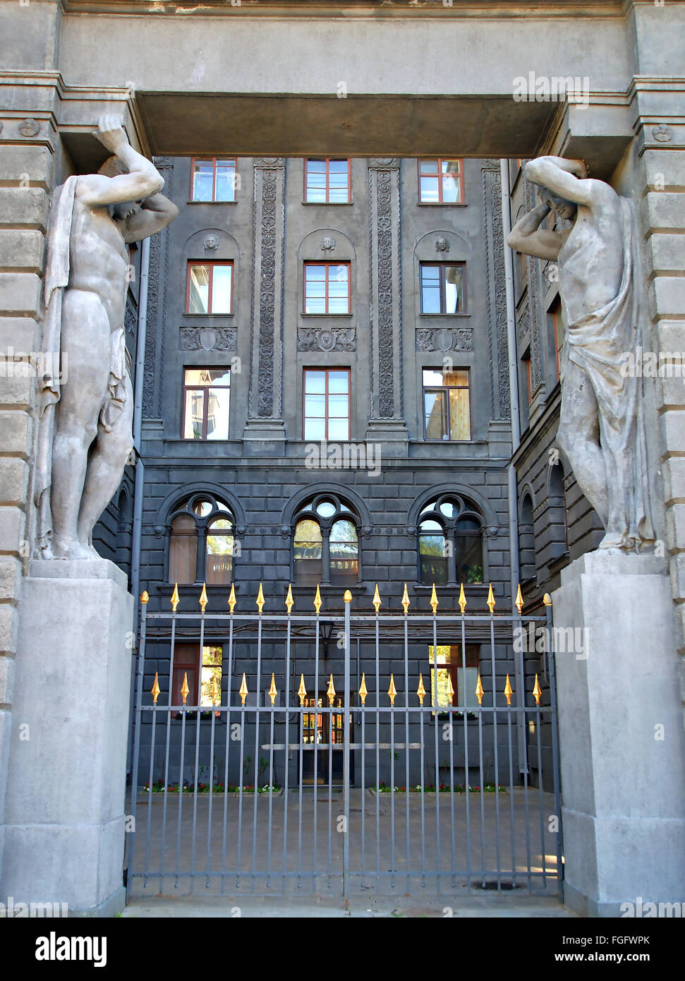 Atlas at the main entrance to the building holding portal beam ...