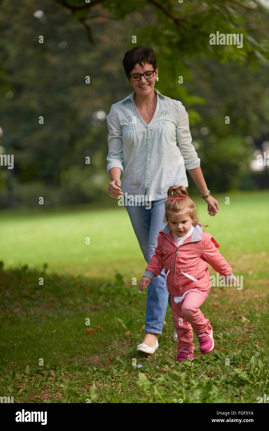 happy family playing together outdoor in park Stock Photo - Alamy