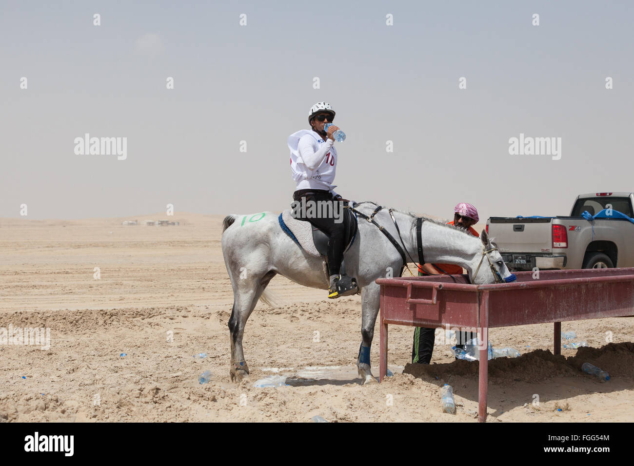 Horse and rider at a water station on Qatar Endurance Course, CHI Al