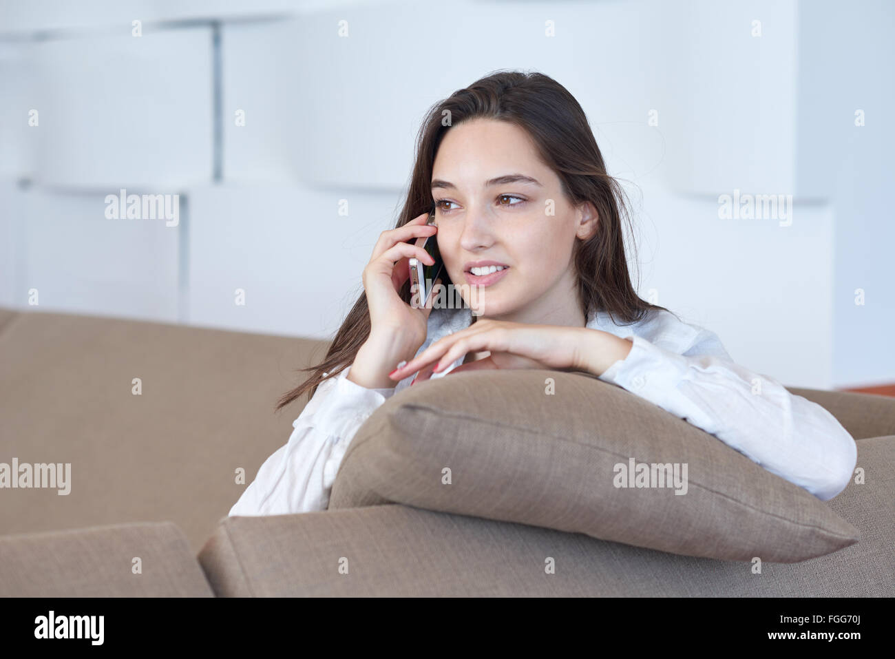 young woman using cellphone at home Stock Photo Alamy