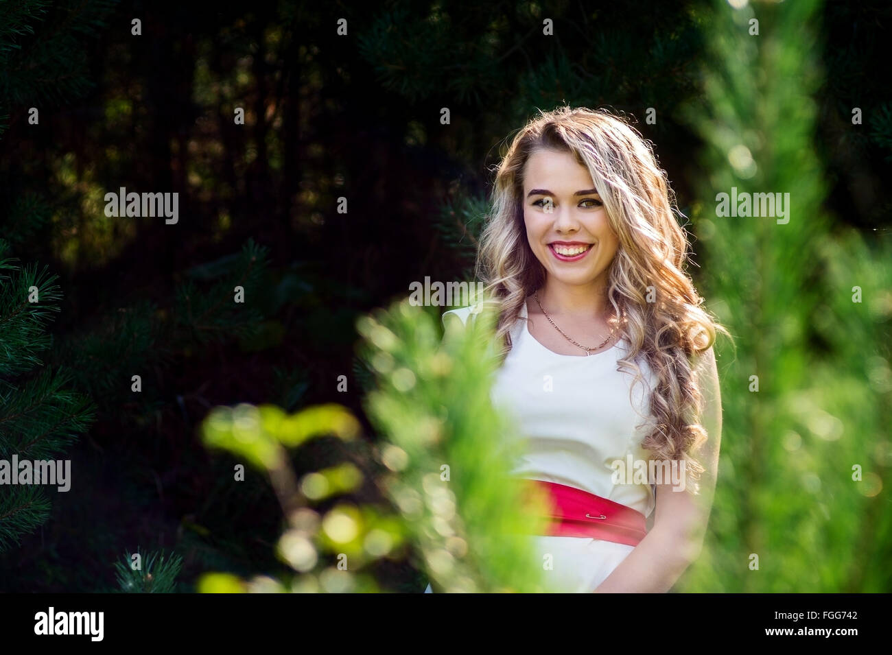 Summer photo smiling girl in a white dress Stock Photo - Alamy