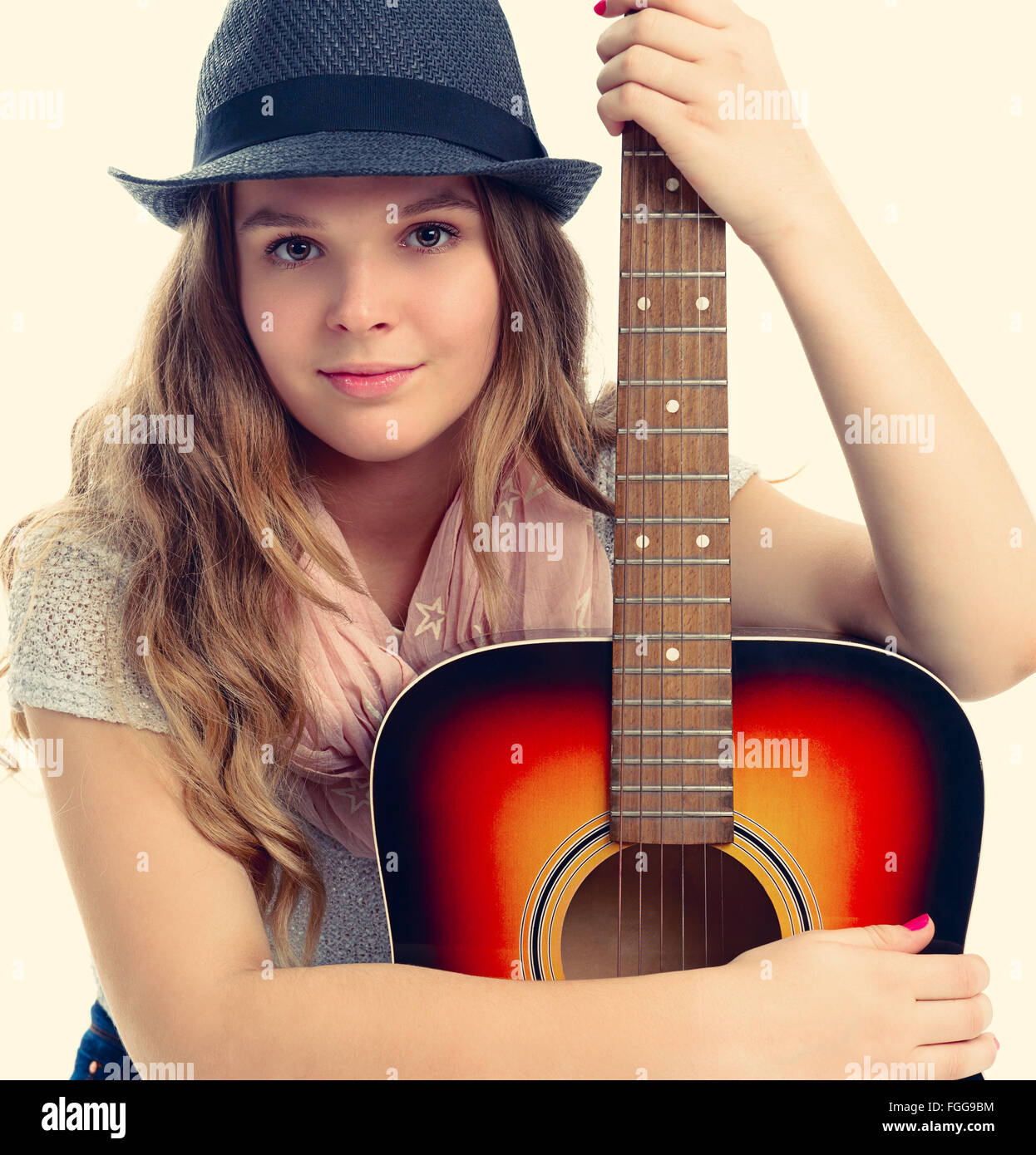 Portrait of a beautiful young woman with a guitar Stock Photo - Alamy