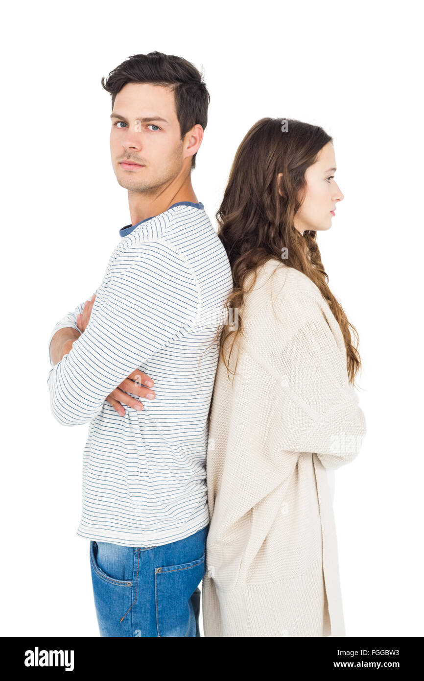 Couple standing back to back Stock Photo