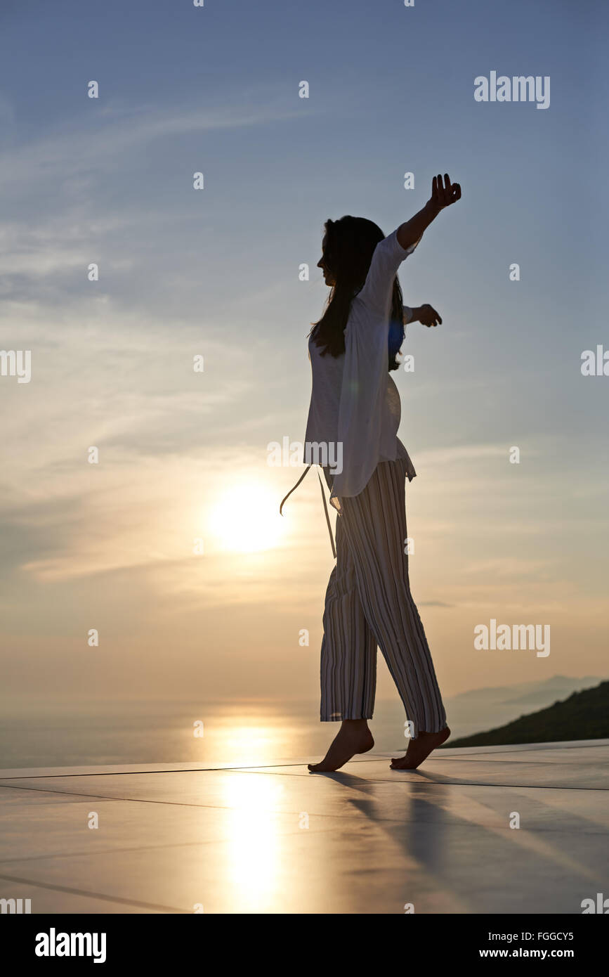 young woman enjoy sunset Stock Photo - Alamy