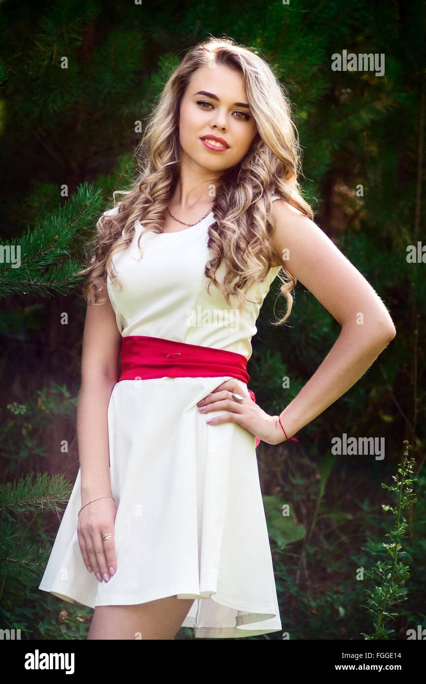 Summer photo smiling girl in a white dress Stock Photo - Alamy