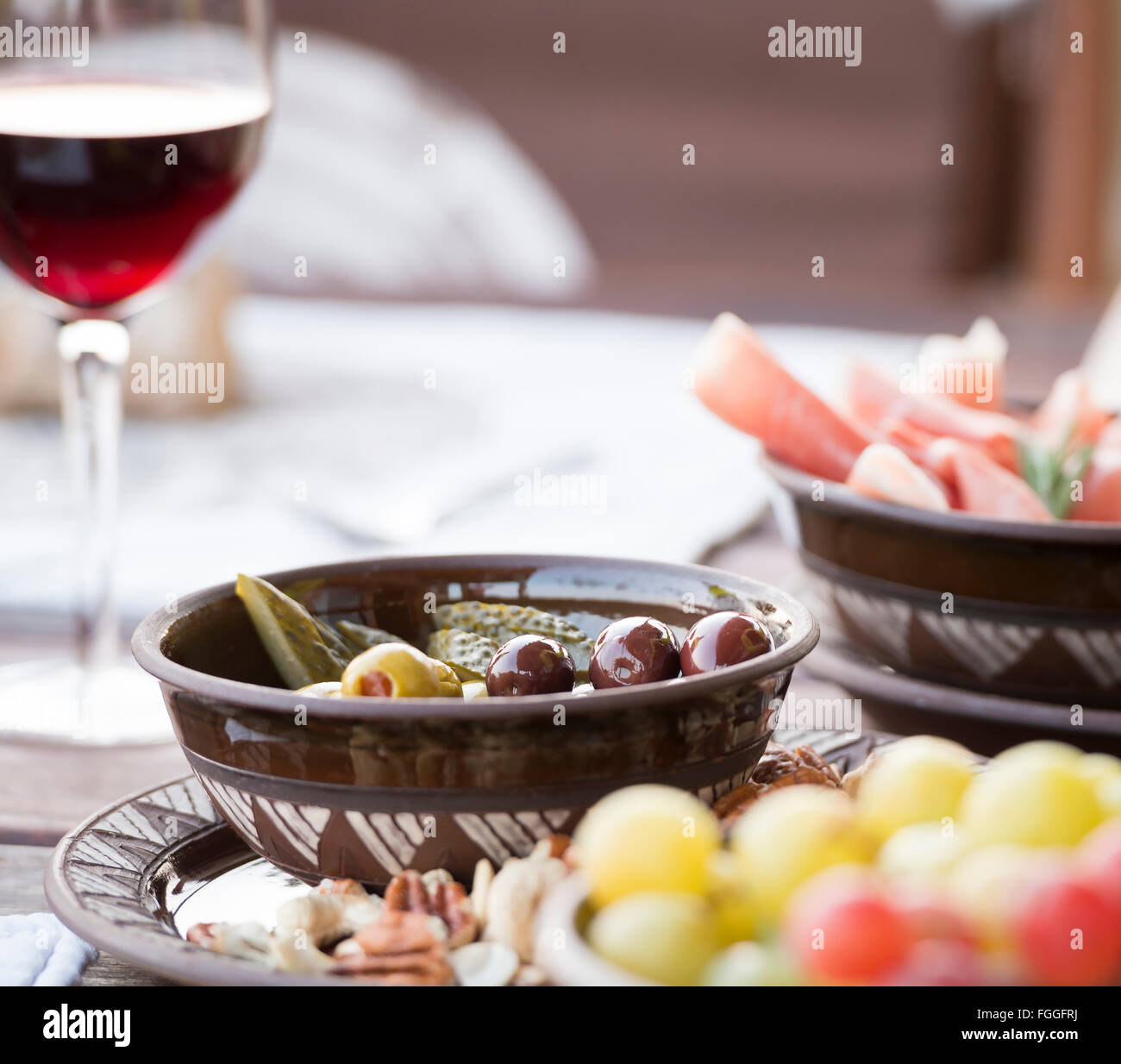 Classic antipasto food typical of the Mediterranean including grapes ...