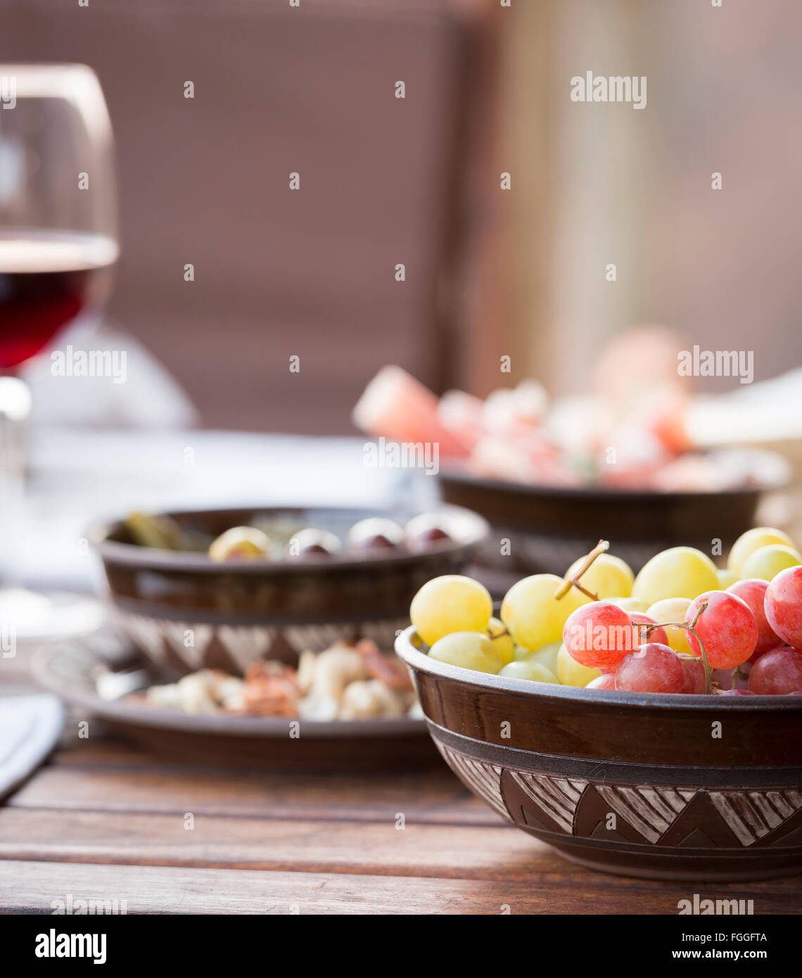 Classic antipasto food typical of the Mediterranean including grapes ...