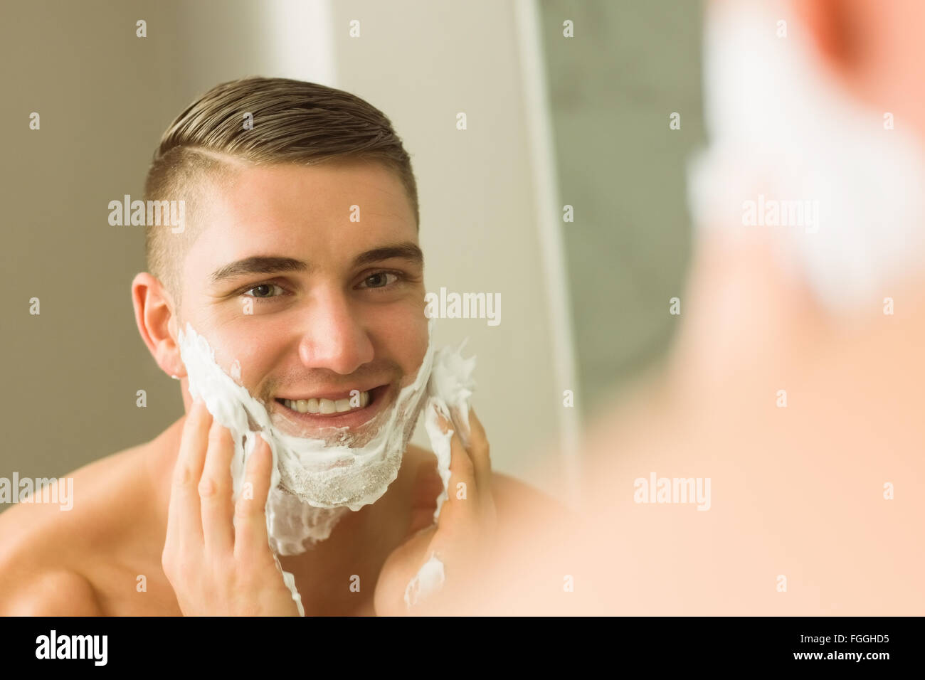 Man putting shaving foam on face Stock Photo Alamy